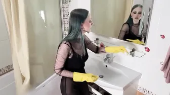 Cleaning the mirror in yellow rubber gloves #6