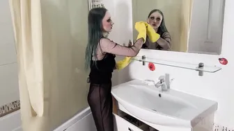 Cleaning the mirror in yellow rubber gloves #7