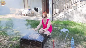 BBQ. Meat on fire. Cooking in a mountain village. Mila naturist #10