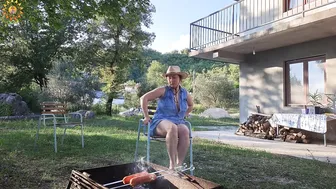 BBQ. Grilled sausages. Cooking in a mountain village. Mila cooking on an open fire. Mila naturist. #9