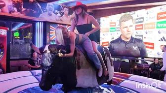 Beautiful ladies riding mechanical bull in Benidorm #2