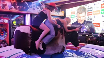 Beautiful ladies riding mechanical bull in Benidorm #5