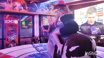 Beautiful ladies riding mechanical bull in Benidorm #6