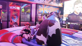 Beautiful ladies riding mechanical bull in Benidorm #9