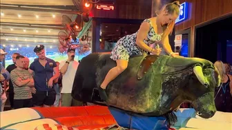 Beautiful lady riding mechanical bull April 30th 2024 in Benidorm Spain ????????