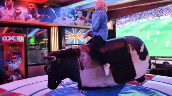 Mechanical bull riding,/ mum on the bull in Benidorm #3