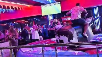 man ridding bull in benidorm #10