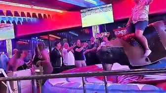 man ridding bull in benidorm #2