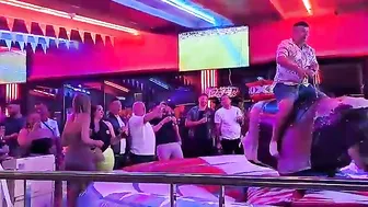 man ridding bull in benidorm #3