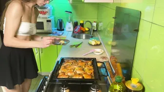 Girl in short skirt cooking baked chicken #10