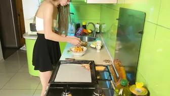 Girl in short skirt cooking baked chicken #4