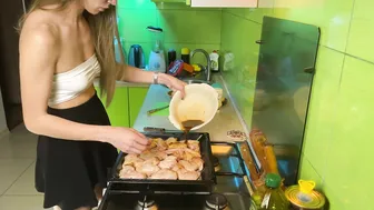 Girl in short skirt cooking baked chicken #5