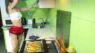 Girl cooking asparagus in short skirt #10