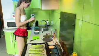 Girl cooking asparagus in short skirt #6