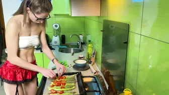 Girl cooking asparagus in short skirt #7