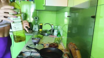 Girl cooking breakfast in leggings and white top #3