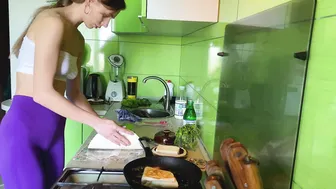 Girl cooking breakfast in leggings and white top #8