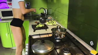 Girl in shorts cooking baked broccoli | no bra cooking #4