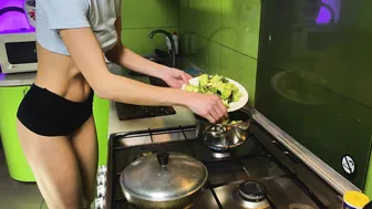 Girl in shorts cooking baked broccoli | no bra cooking #5