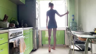 Girl cleaning kitchen in short dress #2