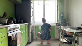 Girl cleaning kitchen in short dress #3