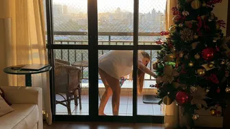 CLEANING TRANSPARENT DOOR WITH SUNSET VIEW