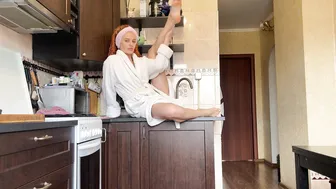 Home workout and stretching in a bathrobe after a shower #2