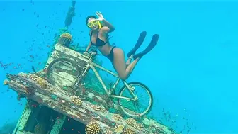 Thong Bikini Free Diving Onto A Bicycle #1